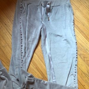 Grey velour sweatsuit with pearl trimming.